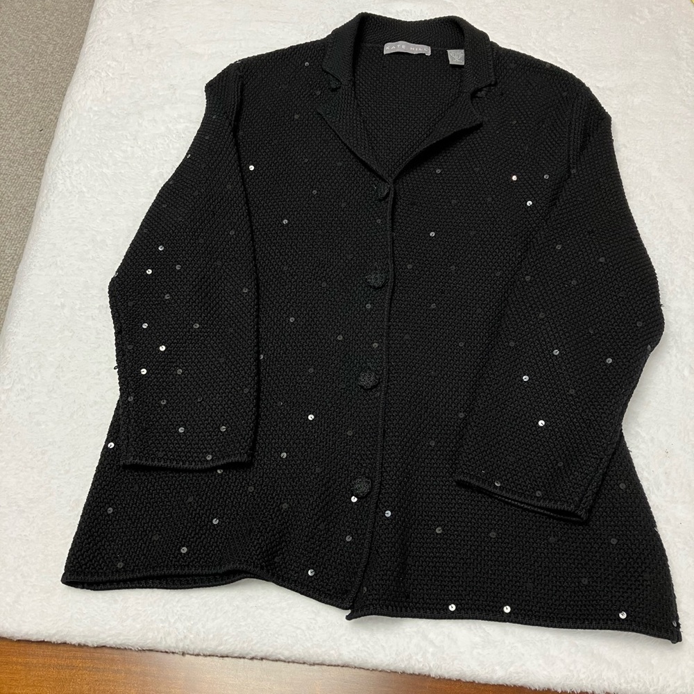 Kate Hill, black cardigan with embellishments.